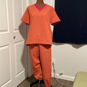 Lovingly used FIGS in Terracotta with Ultra Rose Trim